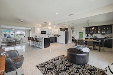 Living room with indoor bar and ceiling fan