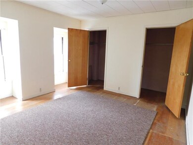 Master bedroom with a wall to wall closet