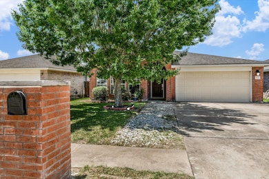 Obstructed view of property with brick siding, co