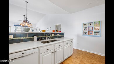 Kitchen with new backsplash and vaulted