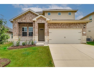 View of front of property with driveway, a front 