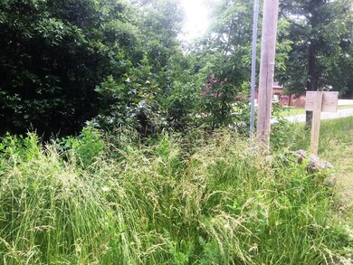 Looking over NE corner of lot towards neighbor's b