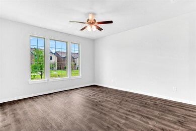 Spare room featuring ceiling fan and dark wood-type flooring
