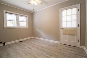 Unfurnished room featuring light wood finished flo