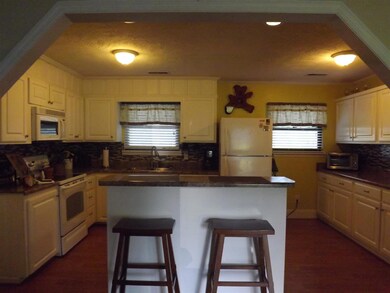 Beautiful Kitchen, White Cabinetry, Laminate Flooring, Spacious Counter Space