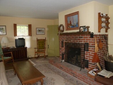 Large living area with fireplace.
