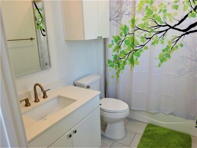 Bathroom with tile patterned flooring, toilet, va