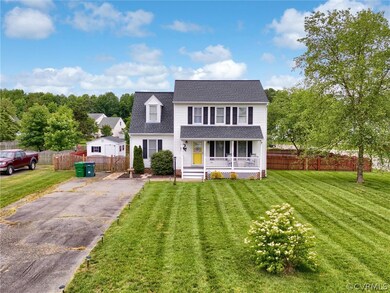View of front of property featuring a front lawn a