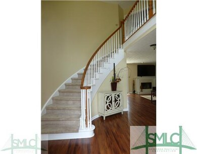 Foyer. Beautifully  Curved Stair Case At Foyer Ent
