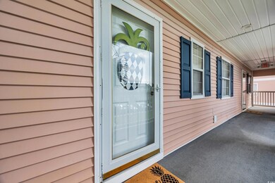 Entrance to property featuring a porch