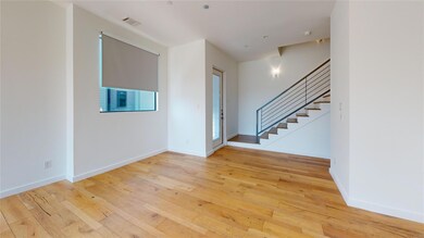 Unfurnished living room featuring light floors and