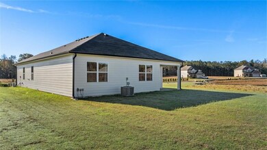 Back of property with a yard