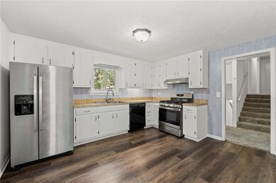 Kitchen with stainless steel appliances, under cab