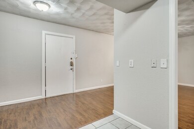 Foyer entrance featuring wood finished floors
