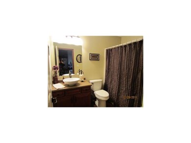 Bathroom. Main floor bath has decorative wash basi