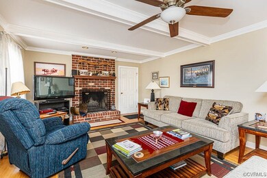 Family Room with hardwood floors & a brick wood bu