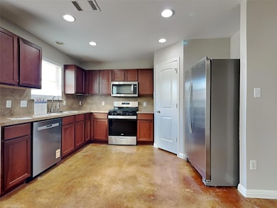 Kitchen featuring stainless steel appliances, fin