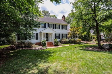 Colonial home featuring a front yard