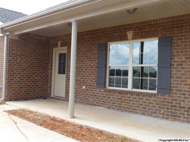 Who says no one sits on front porches anymore?  What is planted in the fields across the street?