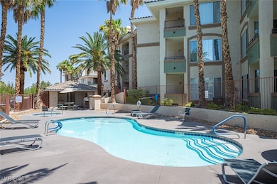 Community pool featuring a patio area