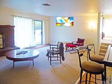 Den with view toward kitchen