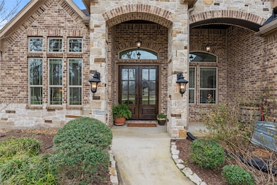 Beautiful stone and brick exterior combine to crea