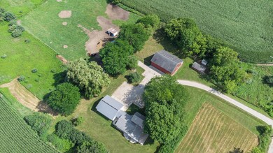 Directly over house and outbuildings