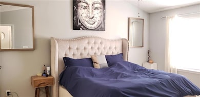 Bedroom with a textured ceiling