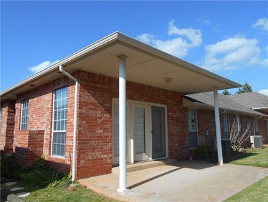 Back of house with covered Patio
