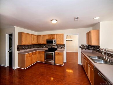 This home features a large kitchen with stainless 