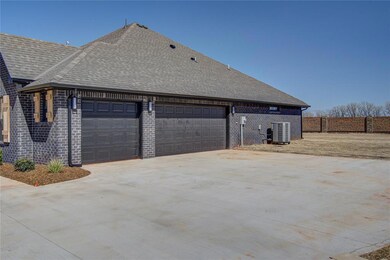 View of side of property featuring a garage and ce