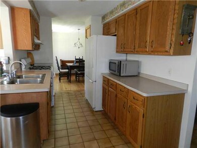 Kitchen. Oak kitchen with ceramic tile floors.