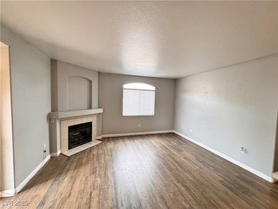 Unfurnished living room with a textured ceiling, w
