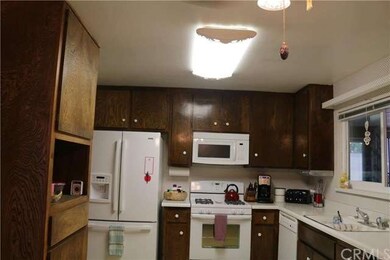 Spacious kitchen with one custom built cabinet