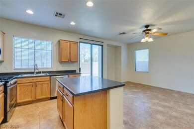 Kitchen and living room separated by island.
