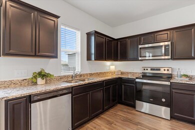 Kitchen featuring appliances with stainless steel
