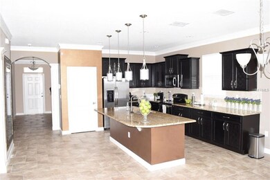 Spacious kitchen with island, appliances included.