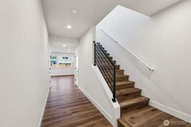 Light filled stairway highlights 9' ceilings-photo is of a similar plan-finishes, features and inclusions can vary