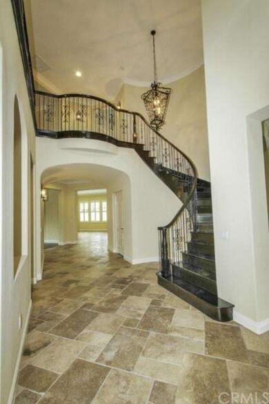 large and welcoming grand staircase with chandelie