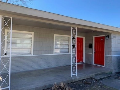 Doorway to property featuring covered porch and br
