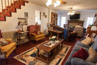 The large living room offers a brick fireplace.