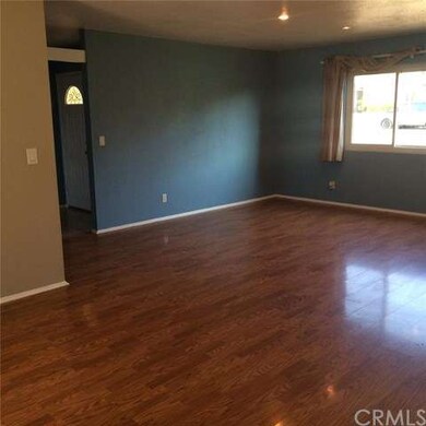 View from kitchen into living room and entry