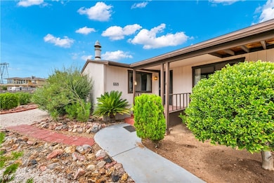 Entrance to property featuring covered porch