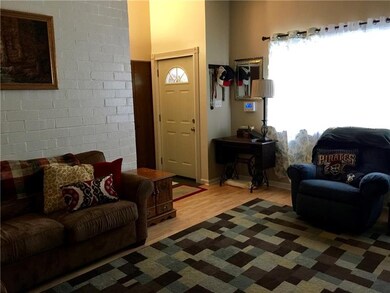 VIEW OF ENTRY WITH COAT CLOSET AND 1/2 BATH ON THE