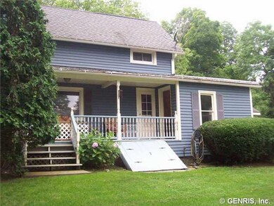 Exterior Front. Covered side porch with new railin