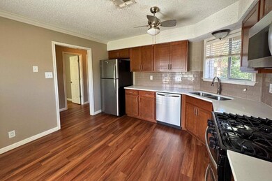 Kitchen featuring stainless steel appliances, a t