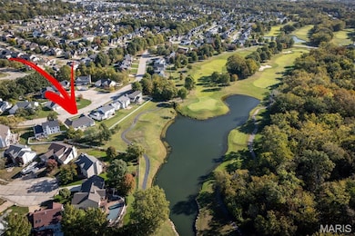 Aerial view of property and golf course