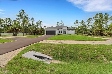 View of front of house with a paved driveway