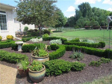 Gorgeous boxwood garden next to rear patio