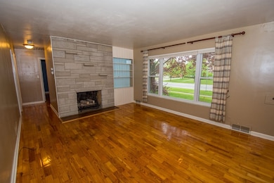 Spacious living space with large picture windows b